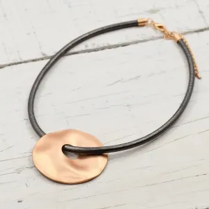Large organic circle with hole on leather